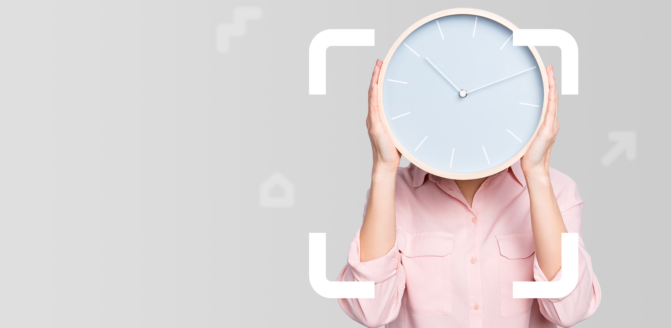 Female clock holder Female in pink long sleeved shirt holding simple clock face in front of her face