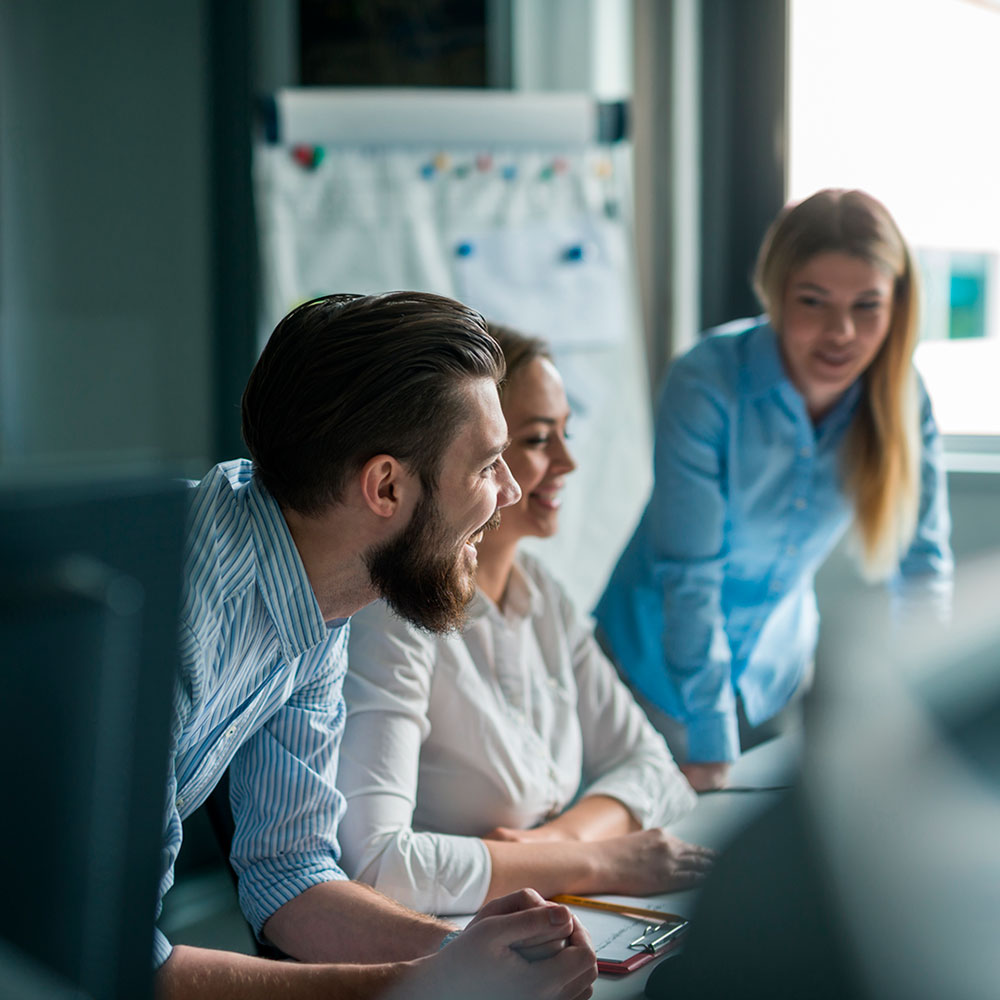 Group of young business professionals in smart casual clothes in an office